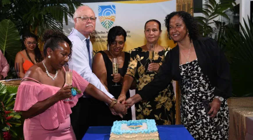 Longest-serving employees Nadette Octave, Anne Dorasamy and Bella Rose join SG David Andre and chief secretary of the Public Service Bureau Shella Mohideen in cutting a cake for the occasion